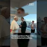 A young man kisses the feet of Pope Leo in the old, traditional greeting. —A Podcast by: Catholics for Catholics